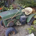 John Deere 112H resting in the back yard